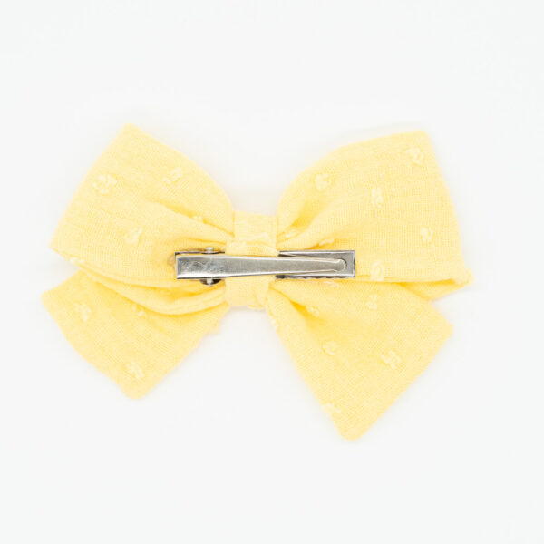 pinza con lazo de color amarillo en tejido plumeti para el cabello de mujer y niña